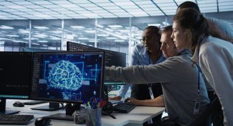 Man requesting help from coworkers after finding bug in data center systems Engineer calling colleagues after finding error in code while doing checkup on server room used for AI workloads. Man requesting help from coworkers after finding bug in data center systems, camera B
