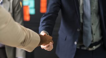 Business people shaking hands in a meeting room Business people shaking hands in a meeting room